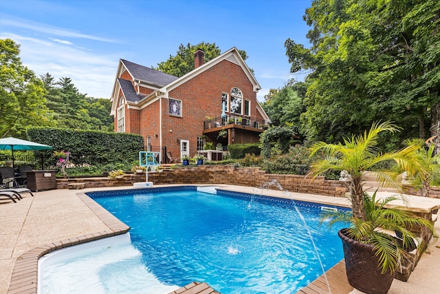 view of swimming pool featuring pool water feature