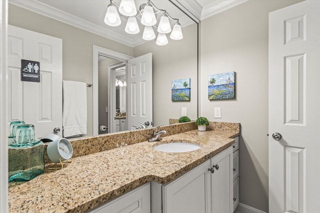 bathroom with crown molding and vanity