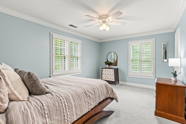 bedroom with ceiling fan, crown molding, and light carpet