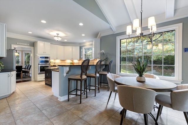 dining room featuring plenty of natural light, beam ceiling, light tile patterned flooring, and crown molding