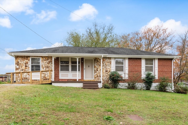 single story home featuring a front lawn and covered porch