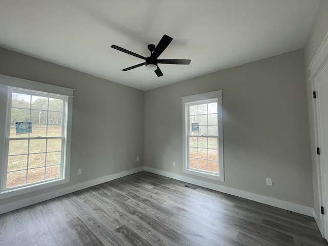 empty room featuring hardwood / wood-style floors and ceiling fan