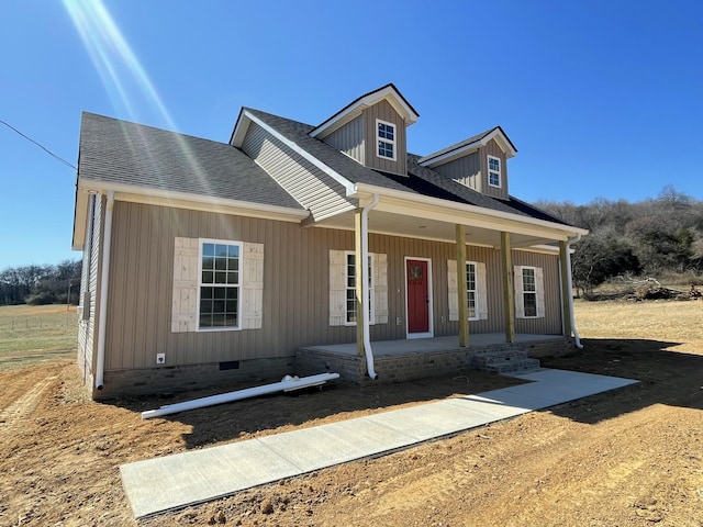 view of front of property featuring a shingled roof, crawl space, and covered porch