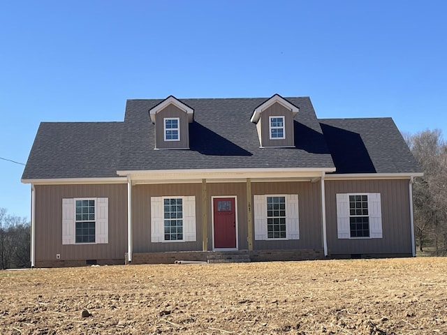 view of front facade with roof with shingles and crawl space