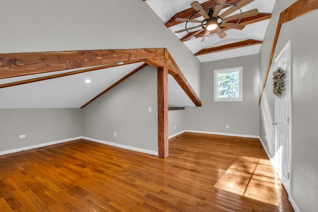 bonus room featuring vaulted ceiling with beams, ceiling fan, and light wood-type flooring