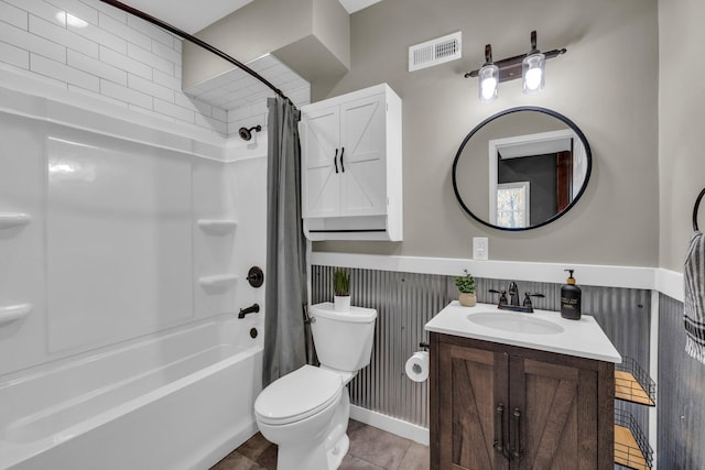 full bathroom featuring shower / bath combo, vanity, and toilet