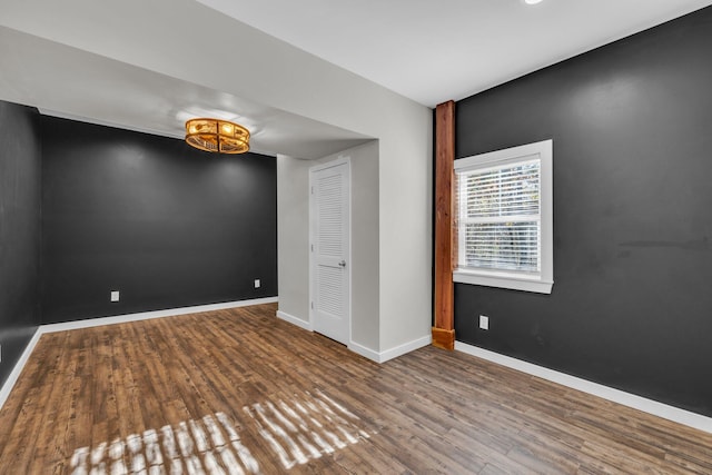 empty room with hardwood / wood-style flooring