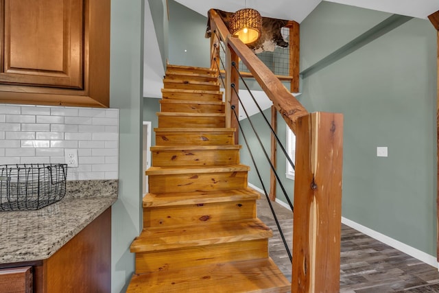 staircase with wood-type flooring