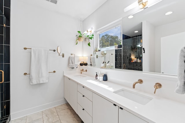 bathroom featuring vanity and an enclosed shower