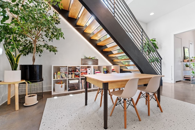 dining area with a high ceiling