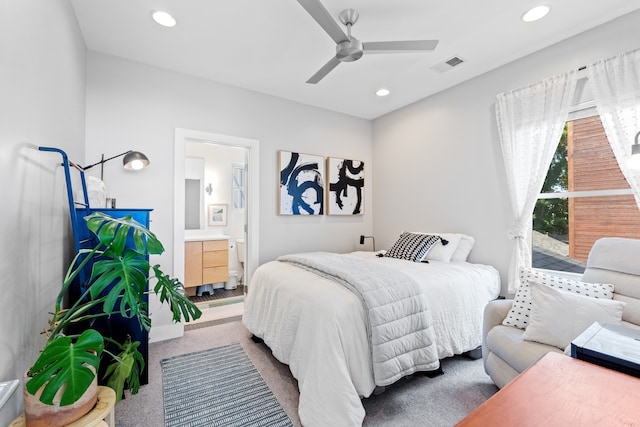 bedroom with carpet, ensuite bathroom, and ceiling fan