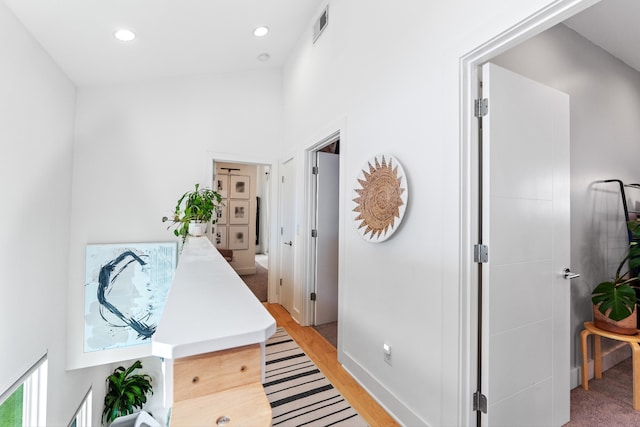 corridor featuring light hardwood / wood-style flooring