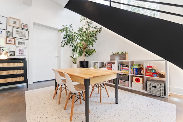 dining space with concrete flooring