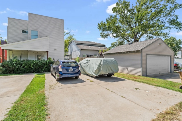 view of home's exterior featuring an outdoor structure and a garage