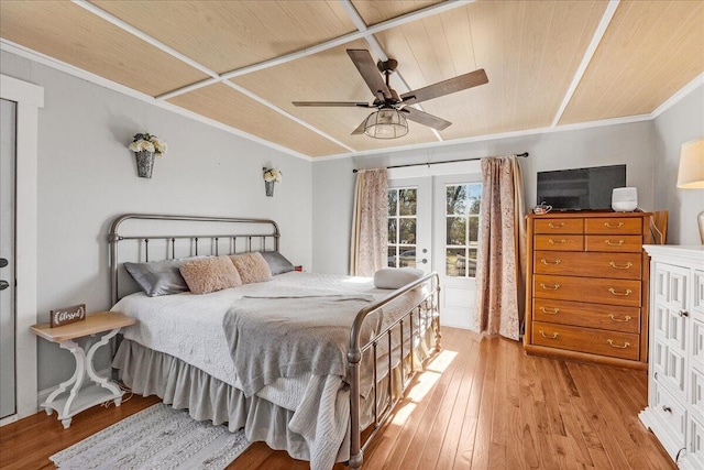 bedroom featuring ceiling fan, french doors, light wood-type flooring, access to outside, and ornamental molding