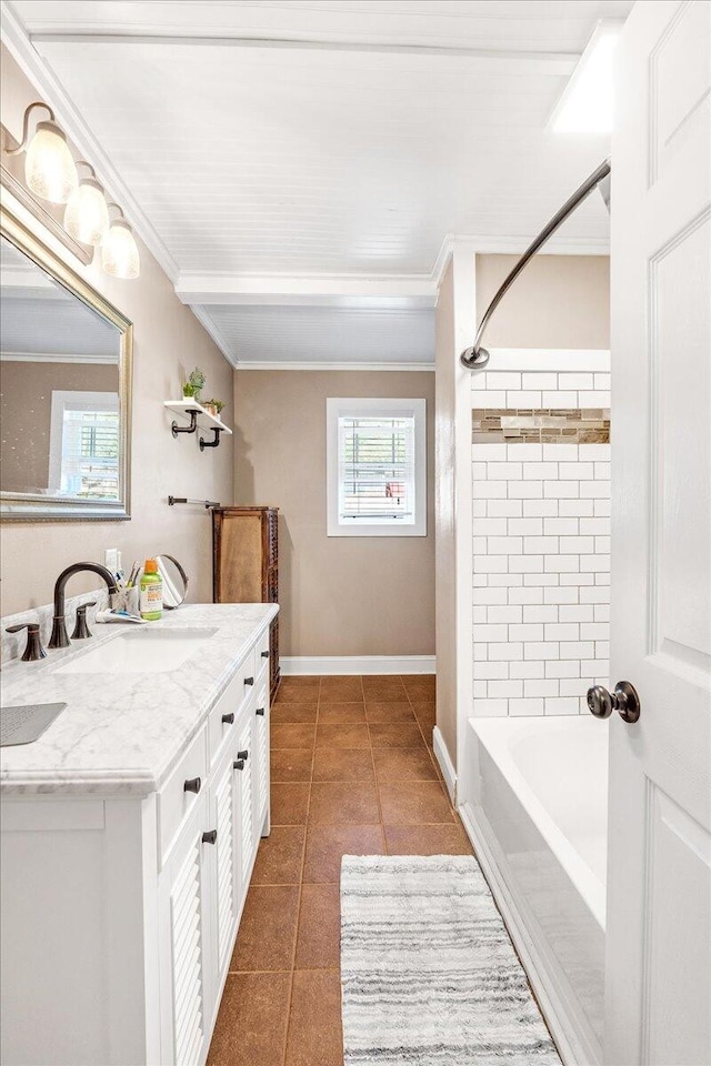 bathroom with tiled shower / bath combo, vanity, tile patterned floors, and crown molding