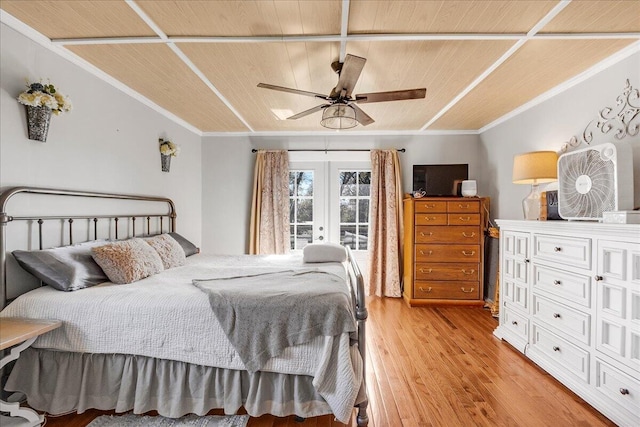 bedroom with french doors, ceiling fan, crown molding, wood-type flooring, and wooden ceiling