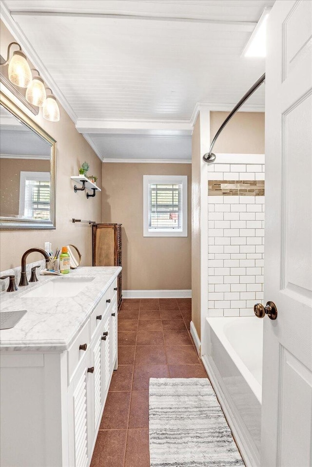 bathroom featuring tile patterned floors, tiled shower / bath, vanity, and ornamental molding