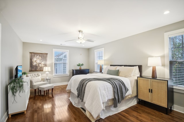 bedroom featuring ceiling fan and dark hardwood / wood-style flooring