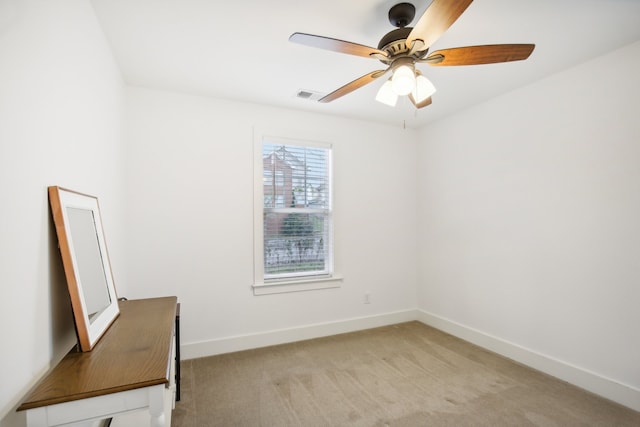 carpeted empty room with ceiling fan