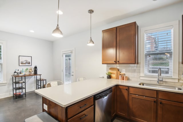 kitchen with tasteful backsplash, stainless steel dishwasher, sink, kitchen peninsula, and pendant lighting