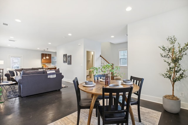 dining room with recessed lighting, visible vents, and baseboards