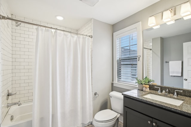 full bathroom featuring toilet, shower / bath combination with curtain, and vanity