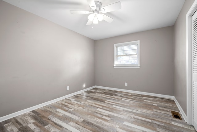 spare room with ceiling fan and light hardwood / wood-style flooring