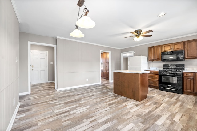 kitchen featuring ornamental molding, ceiling fan, black appliances, decorative light fixtures, and light hardwood / wood-style flooring