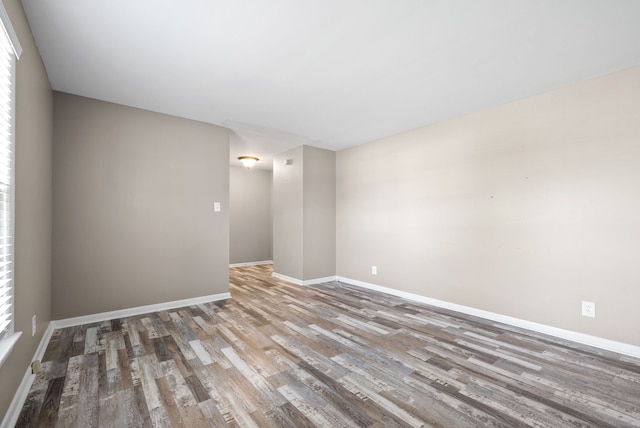 empty room with hardwood / wood-style floors