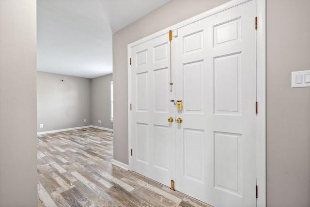 foyer entrance with light wood-type flooring