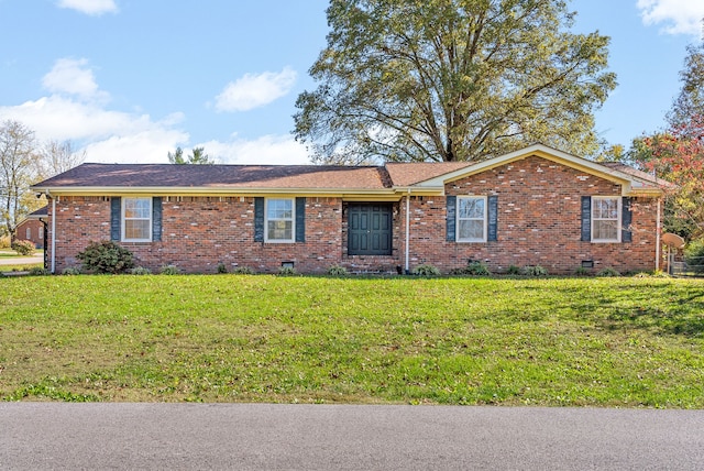 ranch-style home with a front lawn