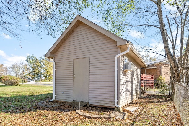 view of outbuilding featuring a yard