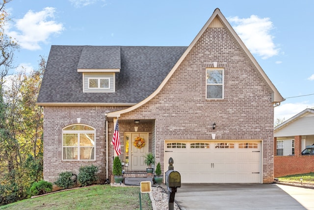 view of front facade with a front yard and a garage