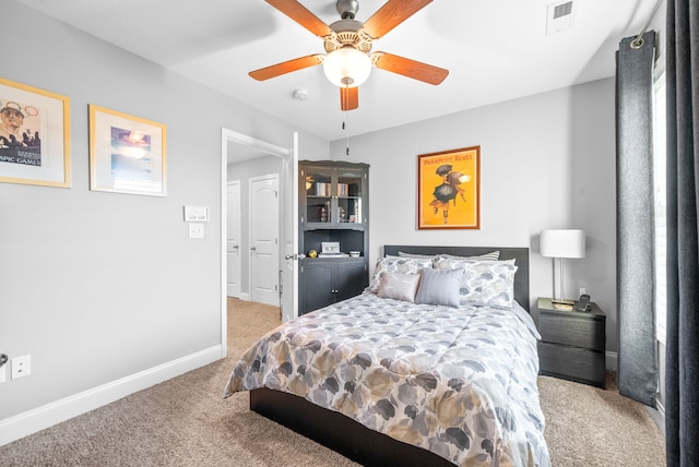 bedroom with ceiling fan and carpet floors