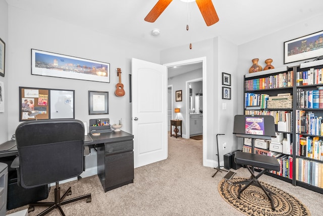 office with light colored carpet and ceiling fan