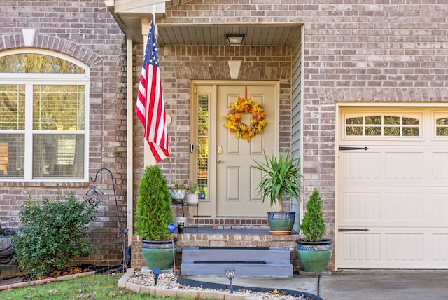 view of exterior entry featuring a garage