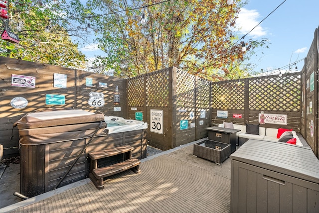 view of patio / terrace featuring a hot tub