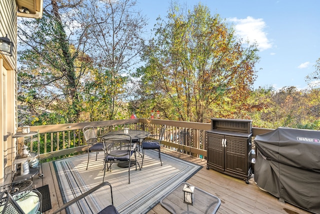 wooden terrace with area for grilling