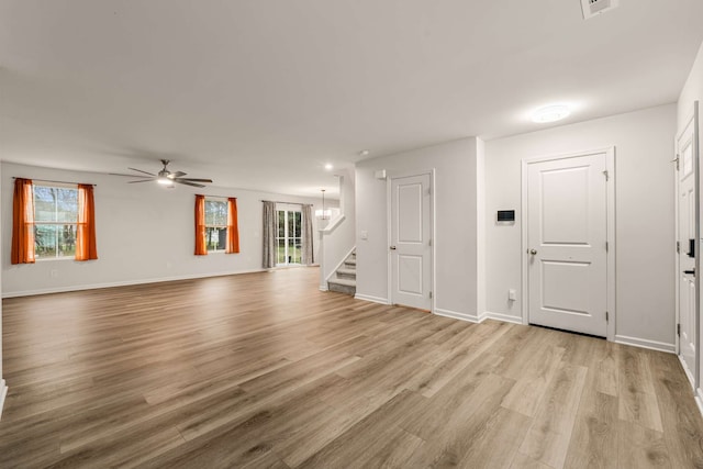 unfurnished living room with ceiling fan and light hardwood / wood-style floors