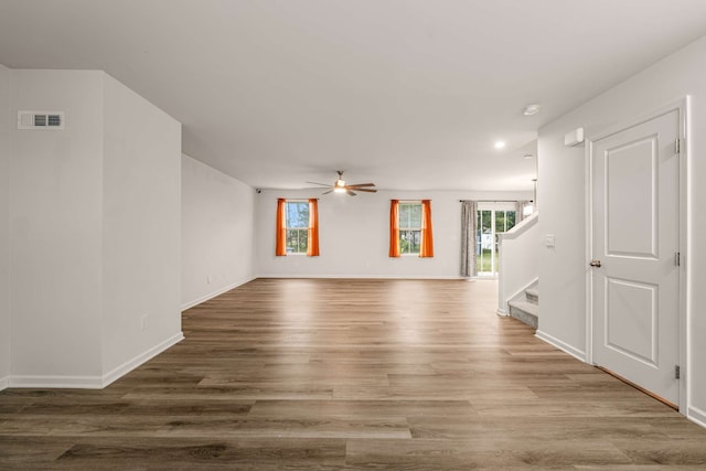 empty room with ceiling fan and wood-type flooring