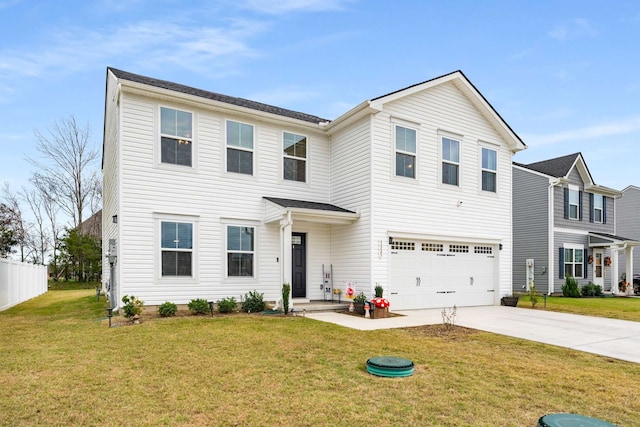 view of front facade with a front yard and a garage