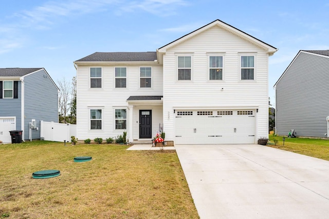 view of front facade with a front yard and a garage