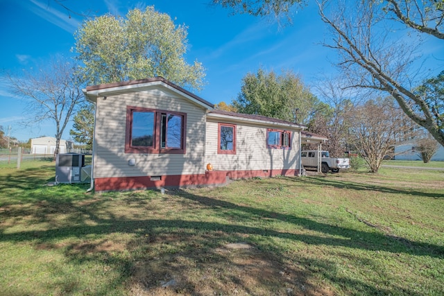 view of property exterior with a lawn