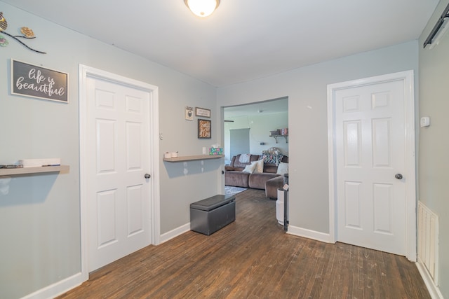 hall featuring dark hardwood / wood-style floors