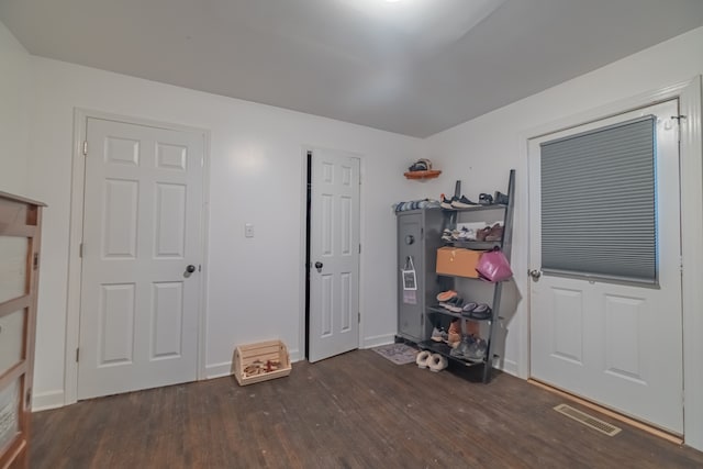 unfurnished bedroom featuring dark wood-type flooring