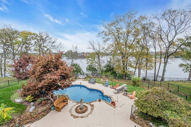 view of swimming pool with a water view and a patio