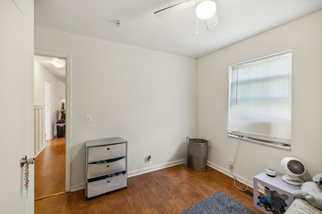 misc room with ceiling fan and dark hardwood / wood-style floors