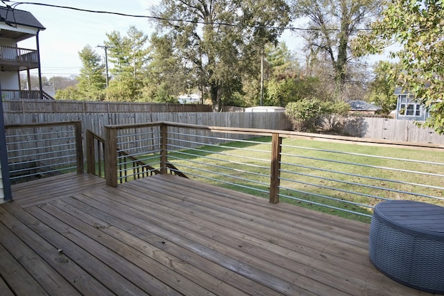 wooden deck featuring a lawn and central AC