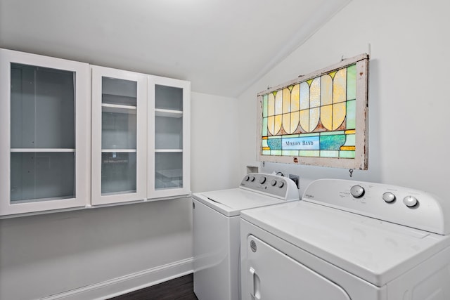 laundry area featuring dark hardwood / wood-style floors and washing machine and clothes dryer